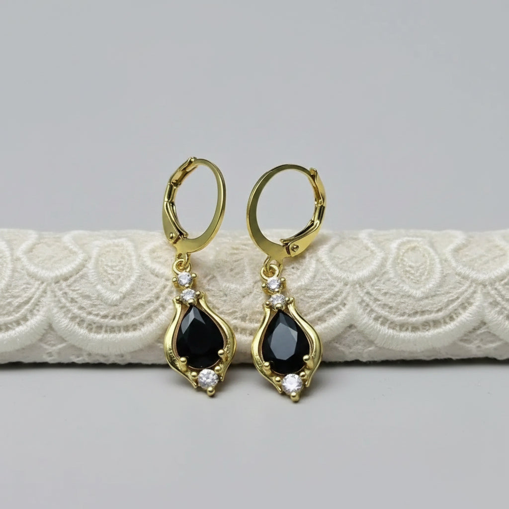 Gold hoop earrings with black stone 