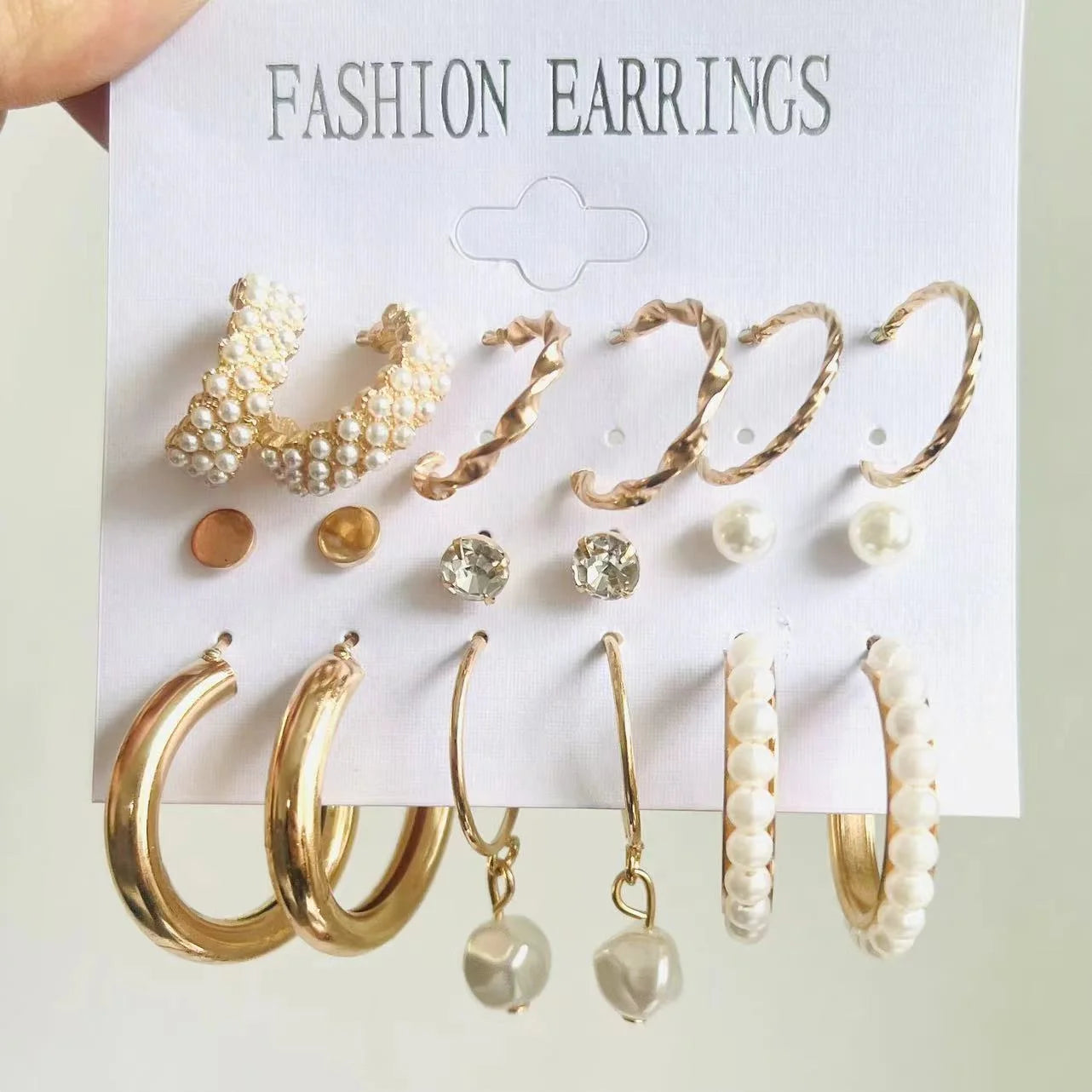 Set of fashion earrings on a display card with 'FASHION EARRINGS' text.