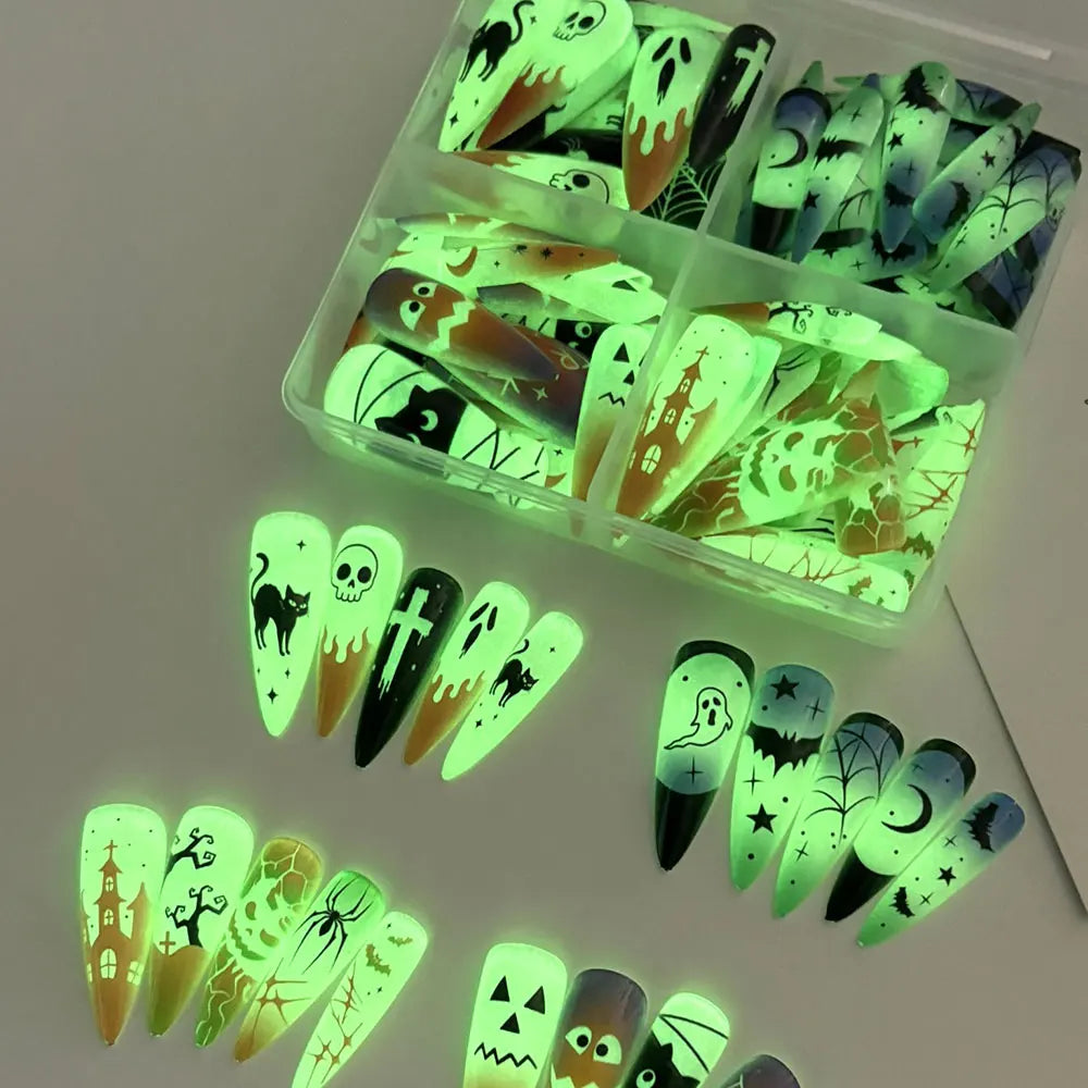 Halloween glow‑in‑the‑dark press‑on nails 96‑piece box packaging with ghost, pumpkin and skull designs.
