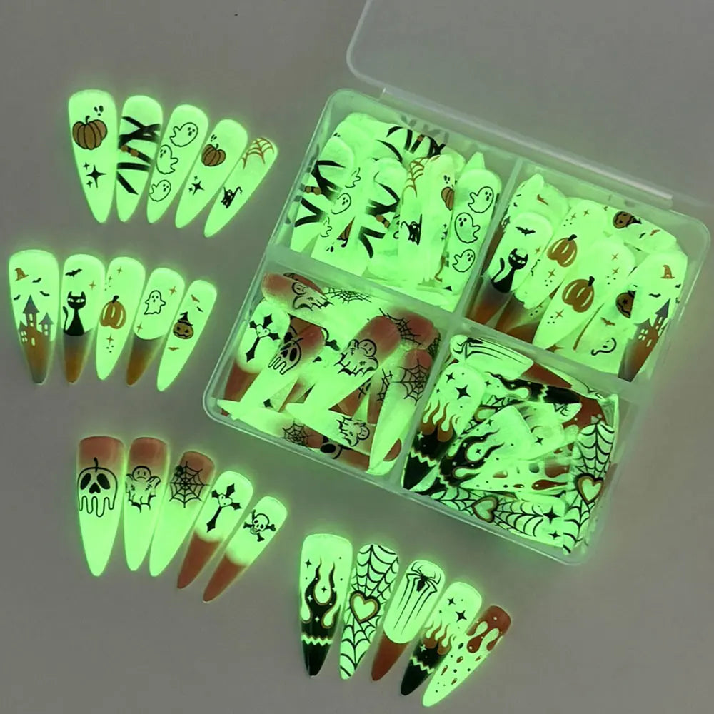 Halloween glow‑in‑the‑dark press‑on nails 96‑piece box packaging with ghost, pumpkin and skull designs.