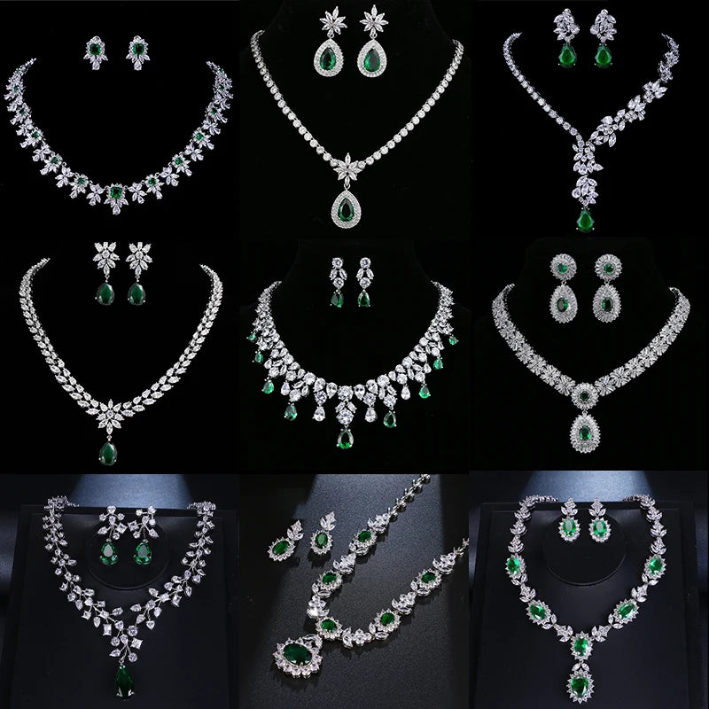 A collage showing eight different styles of women's jewelry sets, including necklaces, earrings, and rings, made of silver-toned metal with clear stones and green emerald-cut gemstones, displayed on black mannequins against a black background.