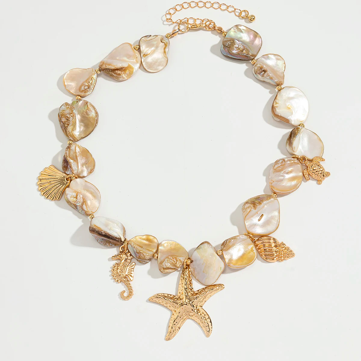 Necklace with shell beads and starfish charm on a light background