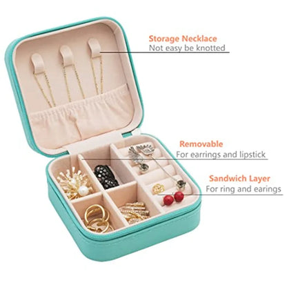 Teal jewelry storage case with compartments for jewelry items on a white background