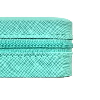 Close-up of a turquoise zipper on a white background