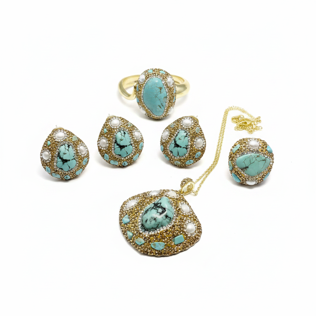 A gold jewelry set featuring a ring, necklace, and earrings with oval turquoise cabochon stones and white pearl-like accents, displayed on a clean white background.